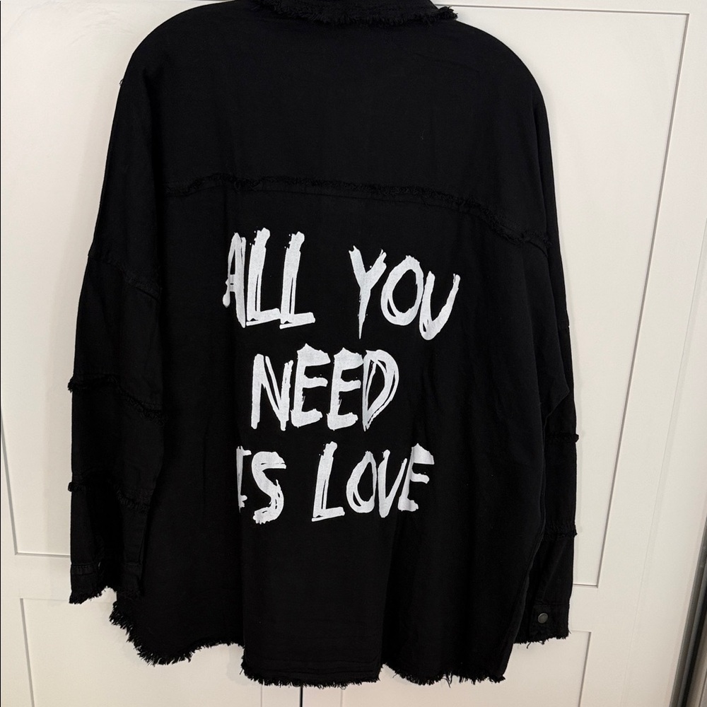 Elan Black Jacket with White 'All You Need Is Love' Graphic